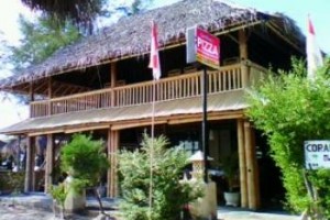 Coral Beach Pizza Cottages Image